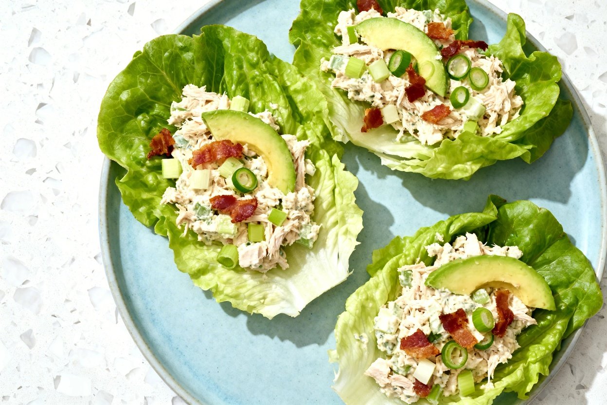 top-down food photo of low carb chicken salad lettuce wraps: three large, crisp romaine (or butter l