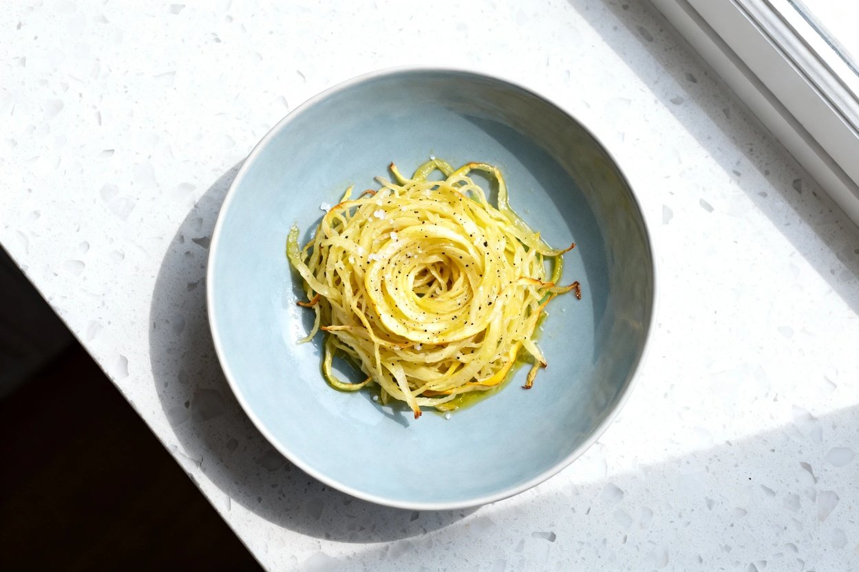top-down food photo of a single serving of low carb baked spaghetti squash strands (roasted spaghet