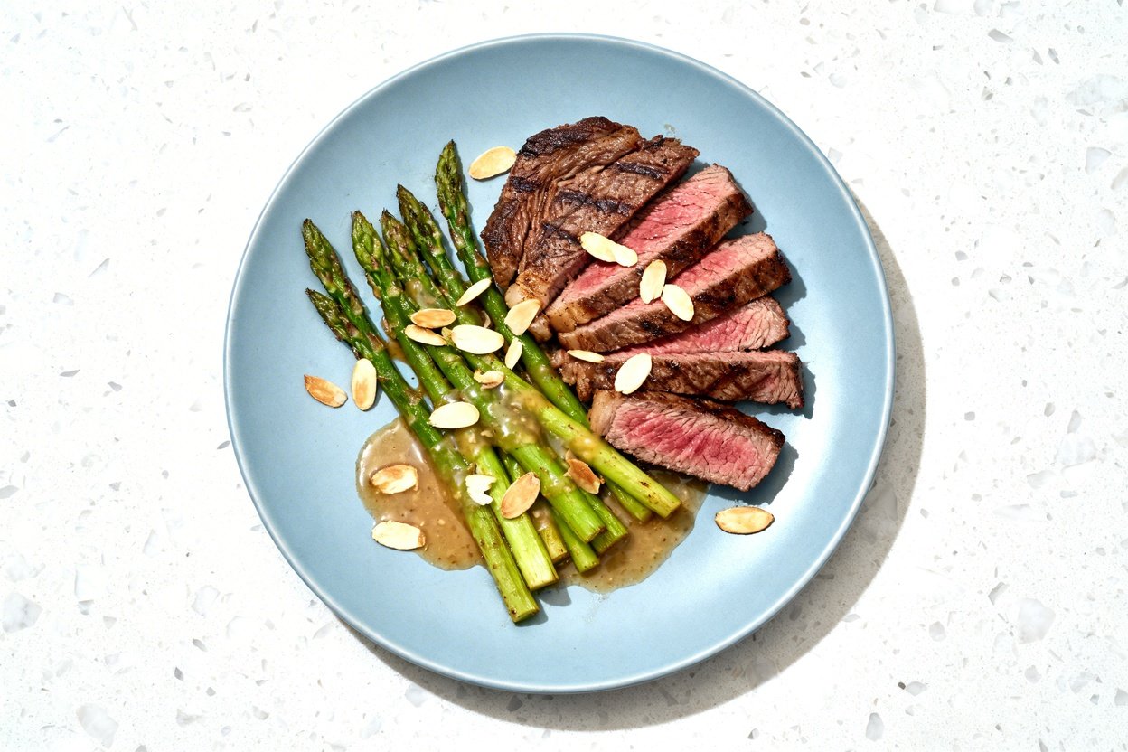 top-down food photo of a finished flexible keto dinner plate built from the same components: sliced 